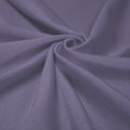 A swirled piece of shiny nylon spandex in the color purple haze.