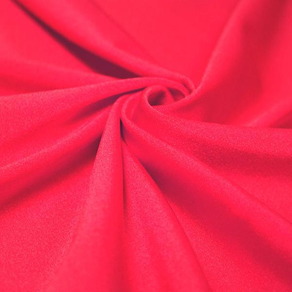 A swirled piece of shiny nylon spandex in the color wonderland.
