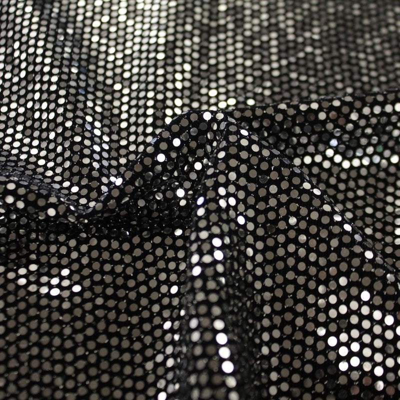 A swirled slink metallic spandex in the color black-silver.