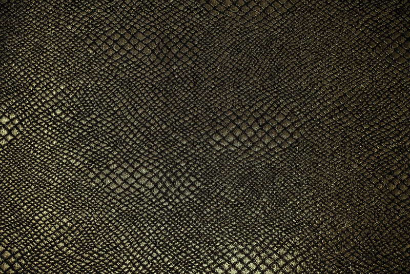 Detailed shot of Snake Skin Scales Metallic Brocade in Black Gold..