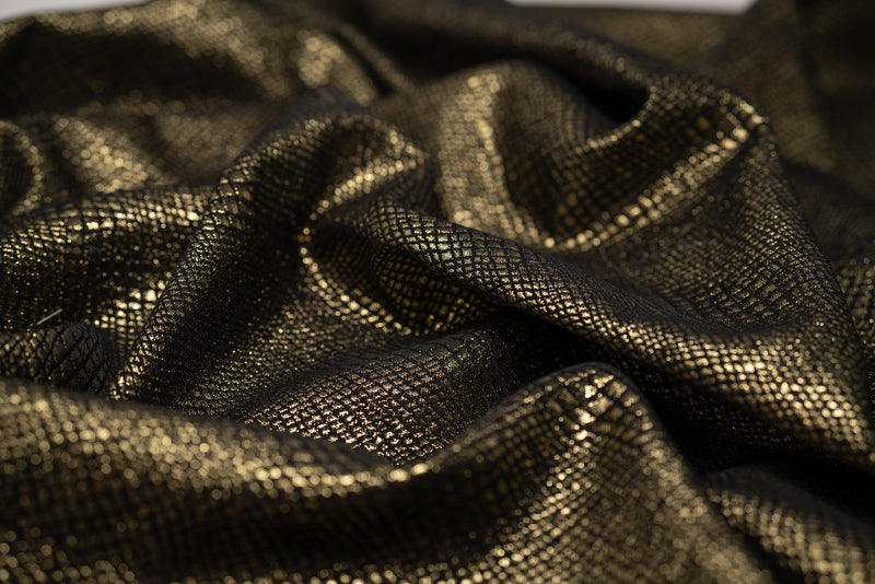 Detailed shot of Snake Skin Scales Metallic Brocade in Black Gold..
