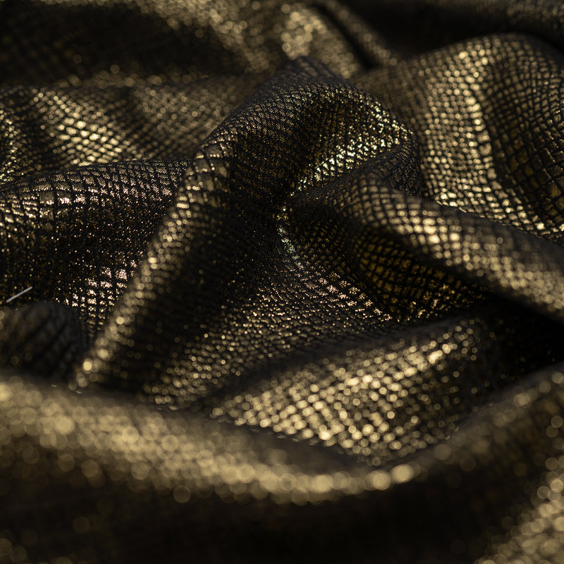 Detailed shot of Snake Skin Scales Metallic Brocade in Black Gold..