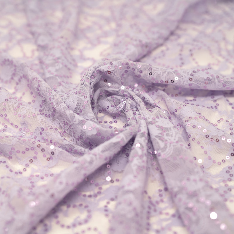 A swirled sample of Sophia Stretch Lace Sequin in Lavender.