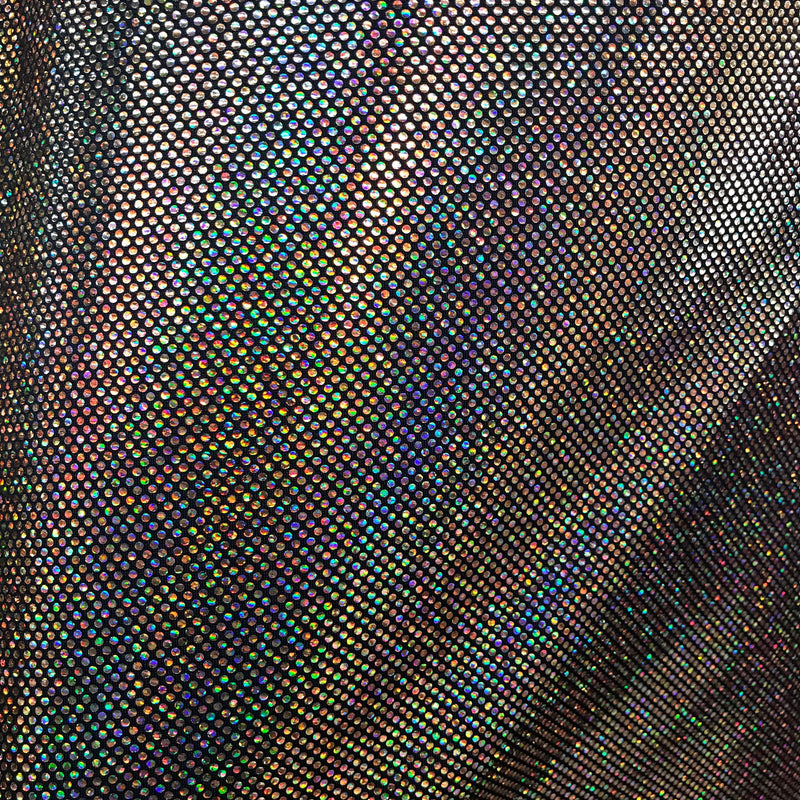 A folded sample of sparkles foiled spandex in the color black-silver.