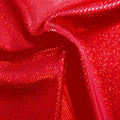 A folded sample of sparkles foiled spandex in the color red-red.