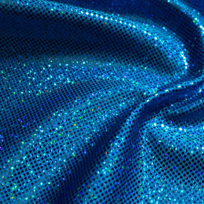A folded sample of sparkles foiled spandex in the color royal blue.