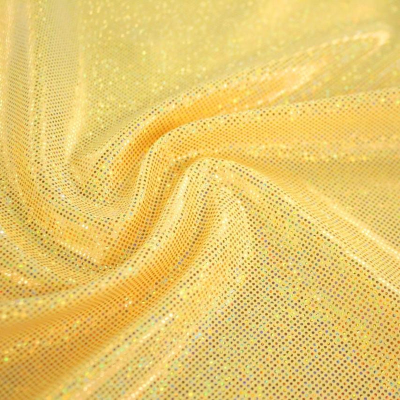 A swirled sample of sparkly foiled spandex in the color sunshine gold.