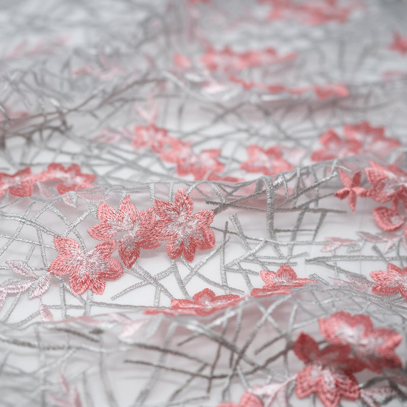 Detailed shot of Spring Has Sprung Embroidered Mesh Fabric in the color pink