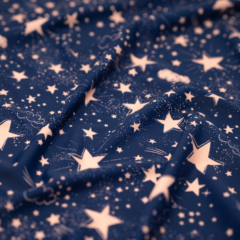 Detail shot of Star Bright Printed Spandex fabric.