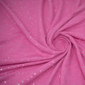 Detailed shot of Stardust Foil Printed Stretch French Terry in color Positive Pink Silver.