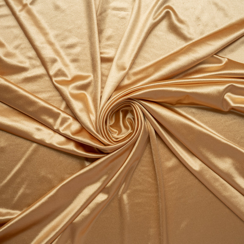 A swirled piece of stretch charmeuse satin in the color nude.