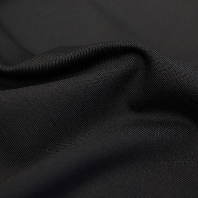 A swirled piece of Superflex Heavy Compression Spandex in the color black.