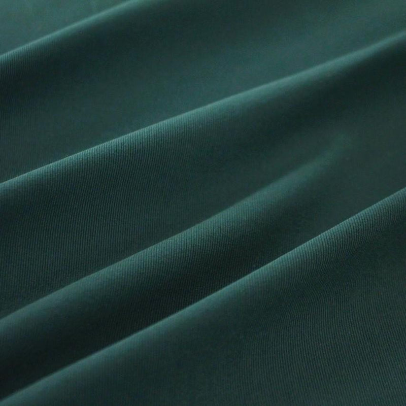 A swirled piece of Superflex Heavy Compression Spandex in the color jade.