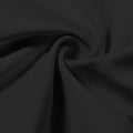 A swirled piece of Synergy Polyester Lycra in the color black.