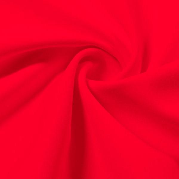 A swirled piece of Synergy Polyester Lycra in the color candy apple.
