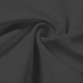 A swirled piece of Synergy Polyester Lycra in the color charcoal.