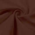A swirled piece of Synergy Polyester Lycra in the color cocoa brown.