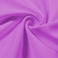 A swirled piece of Synergy Polyester Lycra in the color festival.