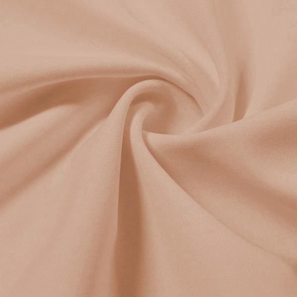 A swirled piece of Synergy Polyester Lycra in the color nude.
