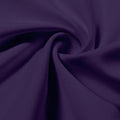 A swirled piece of Synergy Polyester Lycra in the color purple.