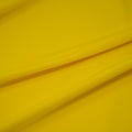 A sample of TechFlex Micro Polyester Spandex in the color Sunbeam