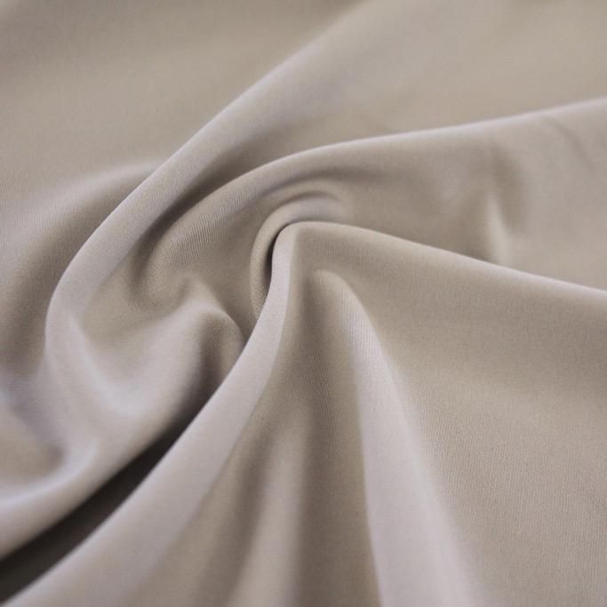 A swirled sample of TechFlex Micro Poly Spandex in color Pewter