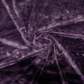 A piece of Tempest Tie Dye on Revival Crushed Stretch Velvet Fabric in color Eggplant..