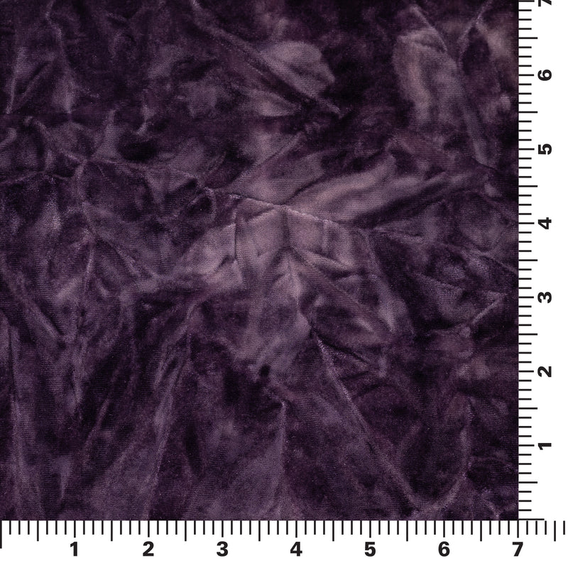 A 7" x7" piece of Tempest Tie Dye on Revival Crushed Stretch Velvet Fabric in color Eggplant shown with ruler for scale.