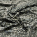 A piece of Tempest Tie Dye on Revival Crushed Stretch Velvet Fabric in color Grey.
