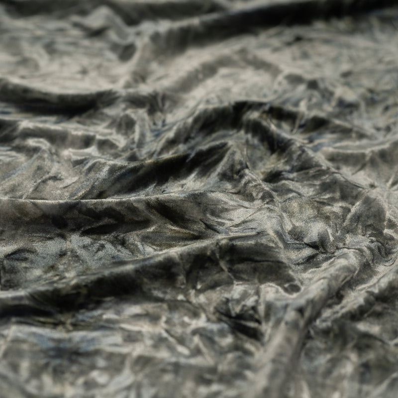 A piece of Tempest Tie Dye on Revival Crushed Stretch Velvet Fabric in color Grey