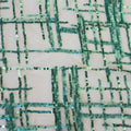 A flat sample of Thin Plaid Stretch Mesh Sequin in the color Ivory-Mint at blue moon fabrics.