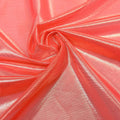 A swirled sample of ultrasheen foiled power mesh with a coral and lt. gold foil available at Blue Moon Fabrics.