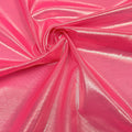 A swirled sample of ultrasheen foiled power mesh with a Hot  pink and lt. gold foil available at Blue Moon Fabrics.