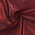 A swirled sample of ultrasheen foiled power mesh with burgunday mesh and red foil available at Blue Moon Fabrics.