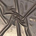 A swirled sample of ultrasheen foiled power mesh with a dark brown mesh and light bronze foil at Blue Moon Fabrics.
