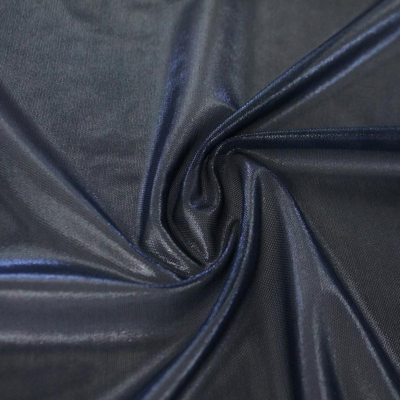 A swirled sample of ultrasheen foiled power mesh with a navy mesh  and navy foil available at Blue Moon Fabrics.