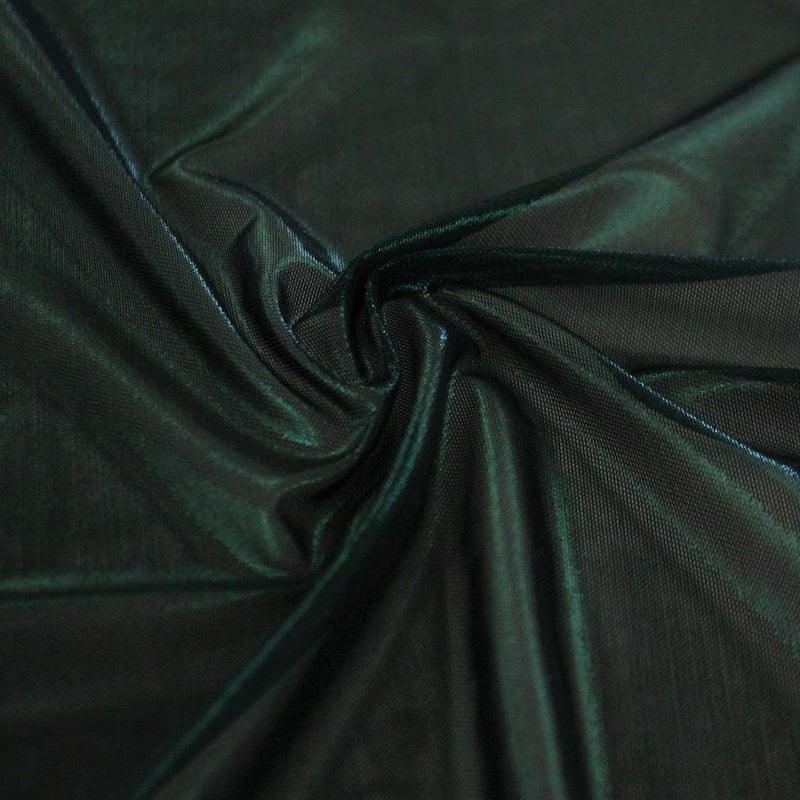 A swirled sample of ultrasheen foiled power mesh with a dark green mesh and dark green foil available at Blue Moon Fabrics.