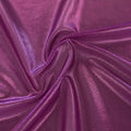 A swirled sample of ultrasheen foiled power mesh with a magenta mesh on dark pink foil available at Blue Moon Fabrics.