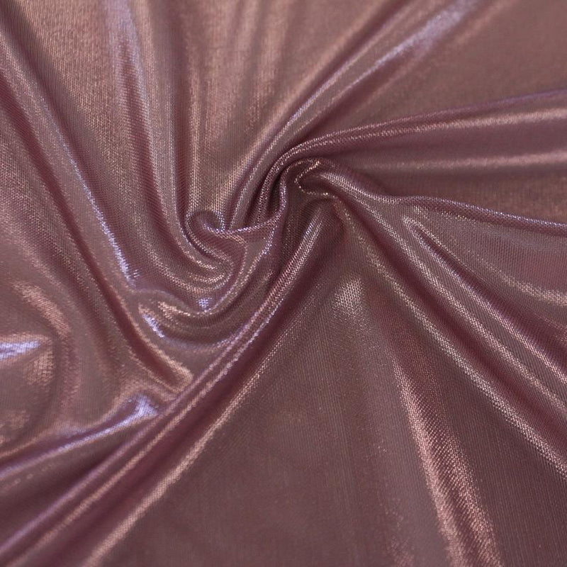 A swirled sample of ultrasheen foiled power mesh with mauve mesh on blush gold foil available at Blue Moon Fabrics.