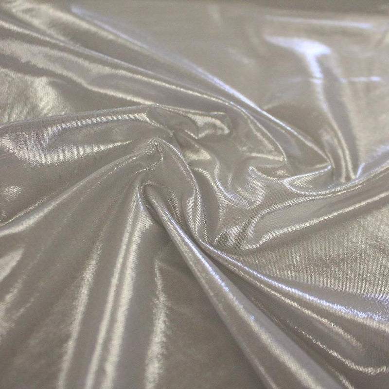 A swirled sample of ultrasheen foiled power mesh with platinum mesh and silver foil available at Blue Moon Fabrics.
