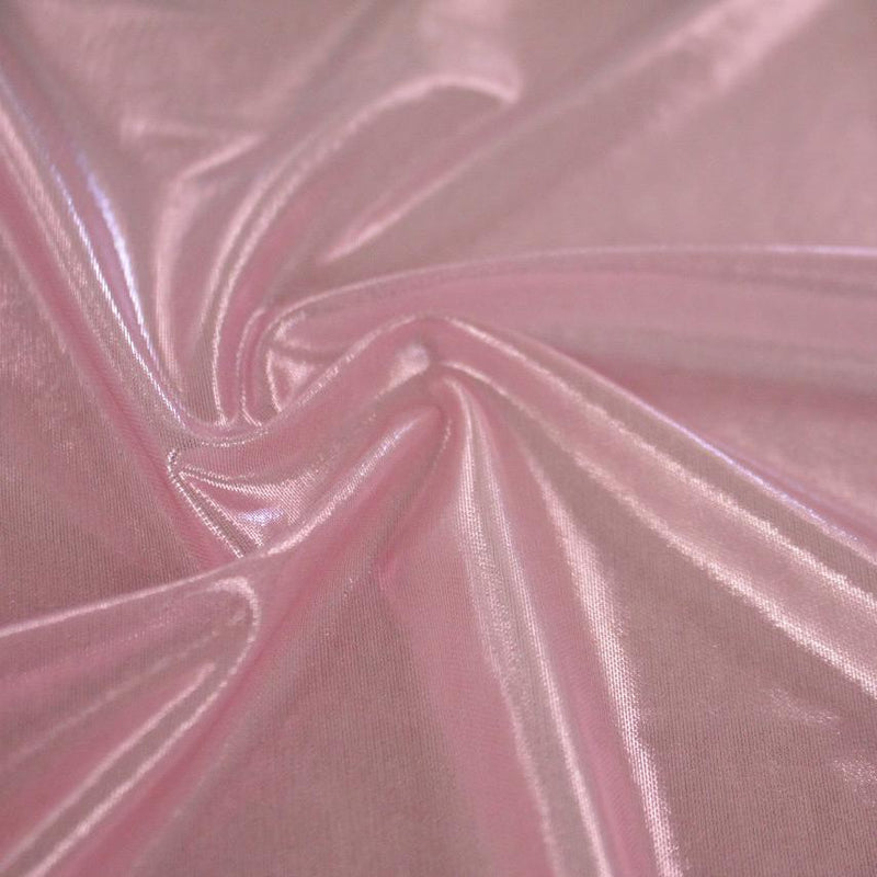 A swirled sample of ultrasheen foiled power mesh with a baby pink mesh and baby pink foil available at Blue Moon Fabrics.