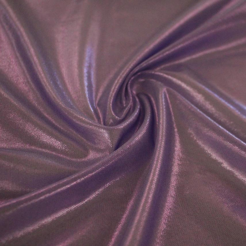 A swirled sample of ultrasheen foiled power mesh with viola mesh and lavender foil available at Blue Moon Fabrics.
