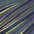 A swirled sample of ultrasheen foiled power mesh with a Eggplant and oz foil available at Blue Moon Fabrics.