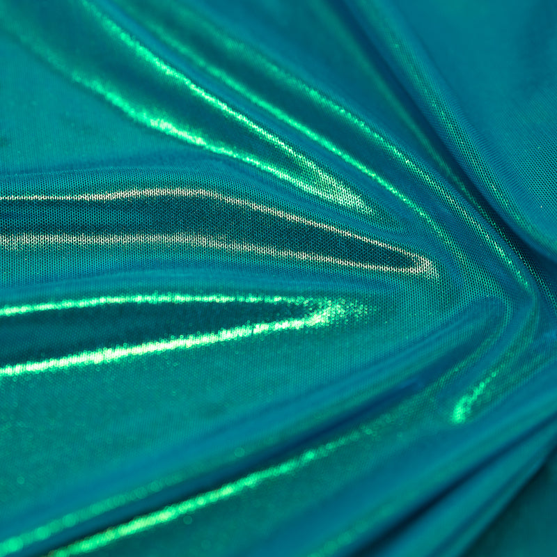 A swirled sample of ultrasheen foiled power mesh with a ocean and oz foil available at Blue Moon Fabrics.