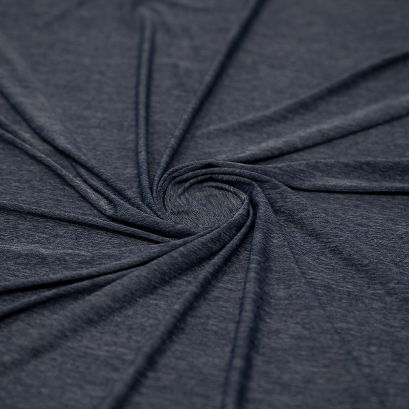 Shot of swirled UniFlex Nylon Polyester Spandex Reversible Knit Top Weight Fabric in color navy