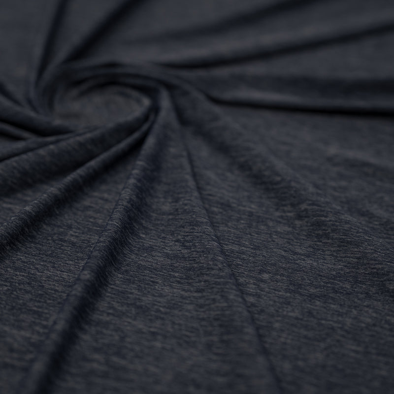 Shot of swirled UniFlex Nylon Polyester Spandex Reversible Knit Top Weight Fabric in color navy