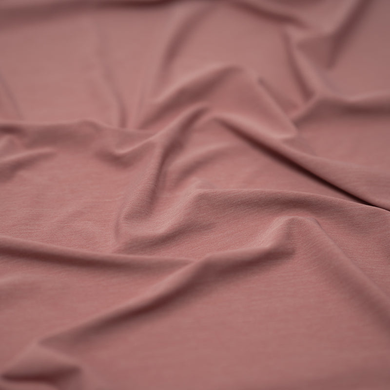 Detailed shot of UniFlex Reversible Spandex Knit in the color Rose pink