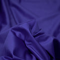 A swirled piece of nylon spandex fabric with an all over shiny look in the color Royal