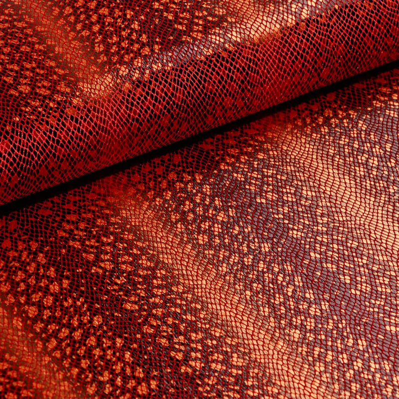 A folded sample of venomour foil printed stretch velvet in the color red available at blue moon fabrics.