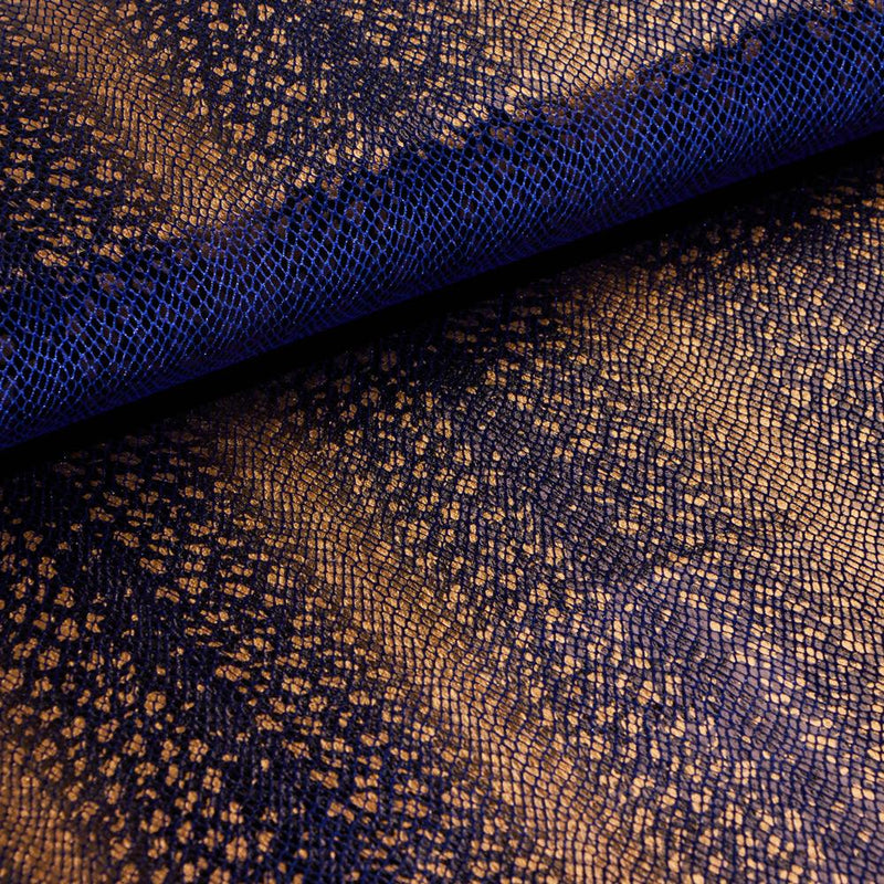 A folded sample of venomour foil printed stretch velvet in the color royal available at blue moon fabrics.